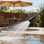 Dewalt jet wash in action cleaning a patio with vibrant garden tools nearby